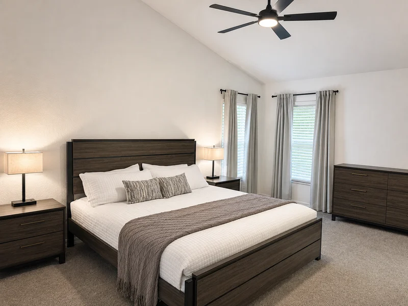 Primary bedroom with king bed and bedside tables